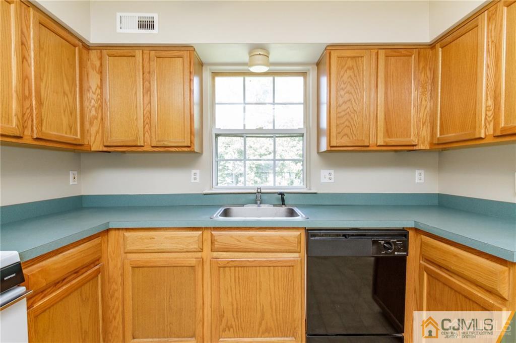 149 Brigantine Road Manahawkin, NJ 08050 - Photo 14 of 29 a kitchen with granite countertop cabinets sink and window