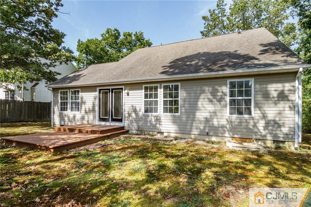 149 Brigantine Road Manahawkin, NJ 08050 - Photo 28 of 29 a front view of a house with a garden