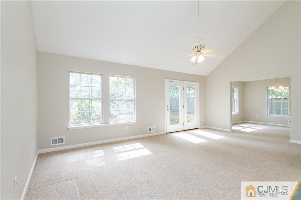 149 Brigantine Road Manahawkin, NJ 08050 - Photo 5 of 29 a view of an empty room with a window