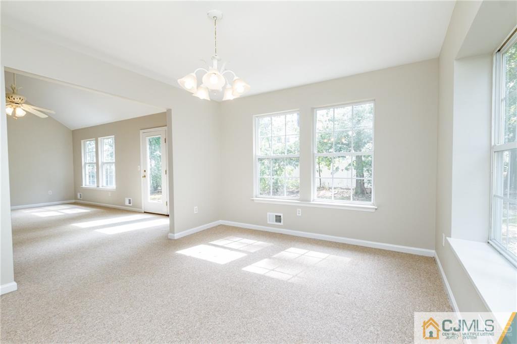 149 Brigantine Road Manahawkin, NJ 08050 - Photo 8 of 29 a view of an empty room with a window