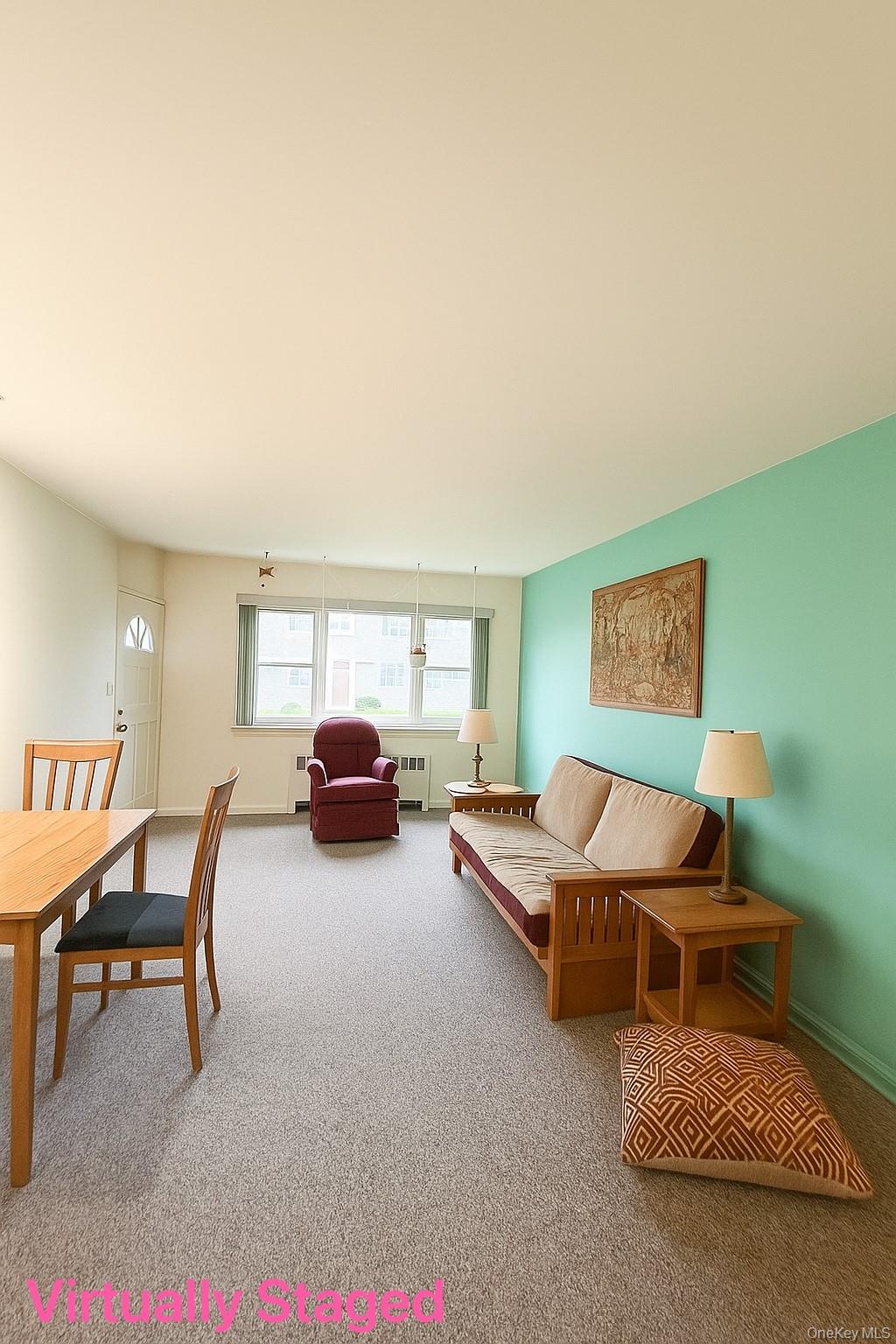 14930 Melbourne Avenue, Unit 395A Queens, NY 11367 - Photo 2 of 8 a living room with furniture and a window
