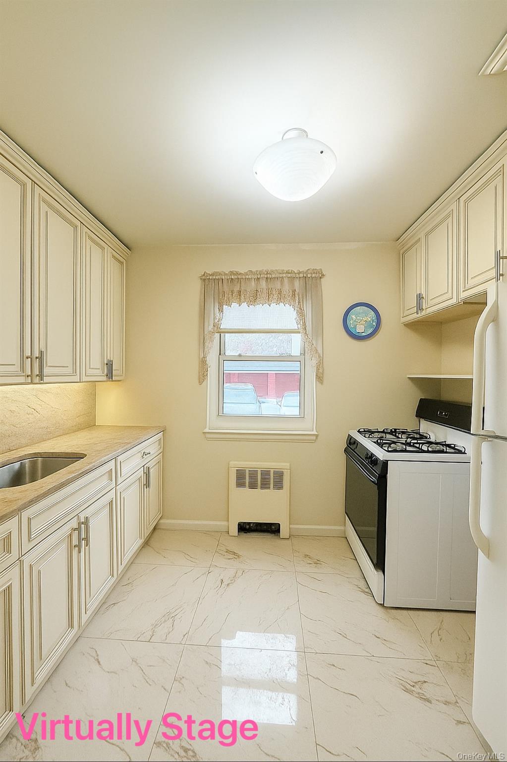14930 Melbourne Avenue, Unit 395A Queens, NY 11367 - Photo 3 of 8 a kitchen with stainless steel appliances granite countertop a stove a sink and a refrigerator