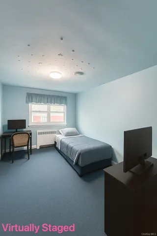 a bedroom with bed and window