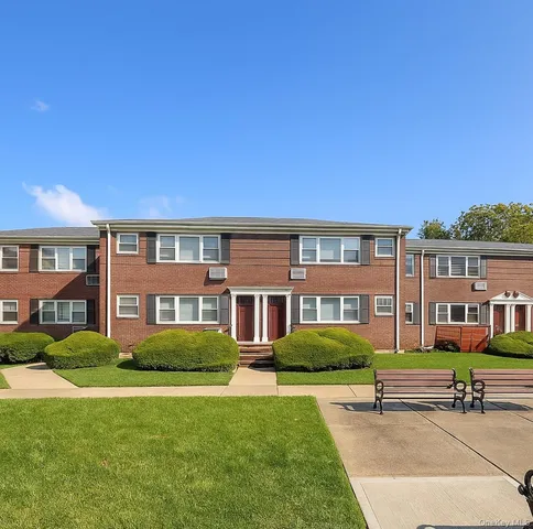 a front view of building with yard