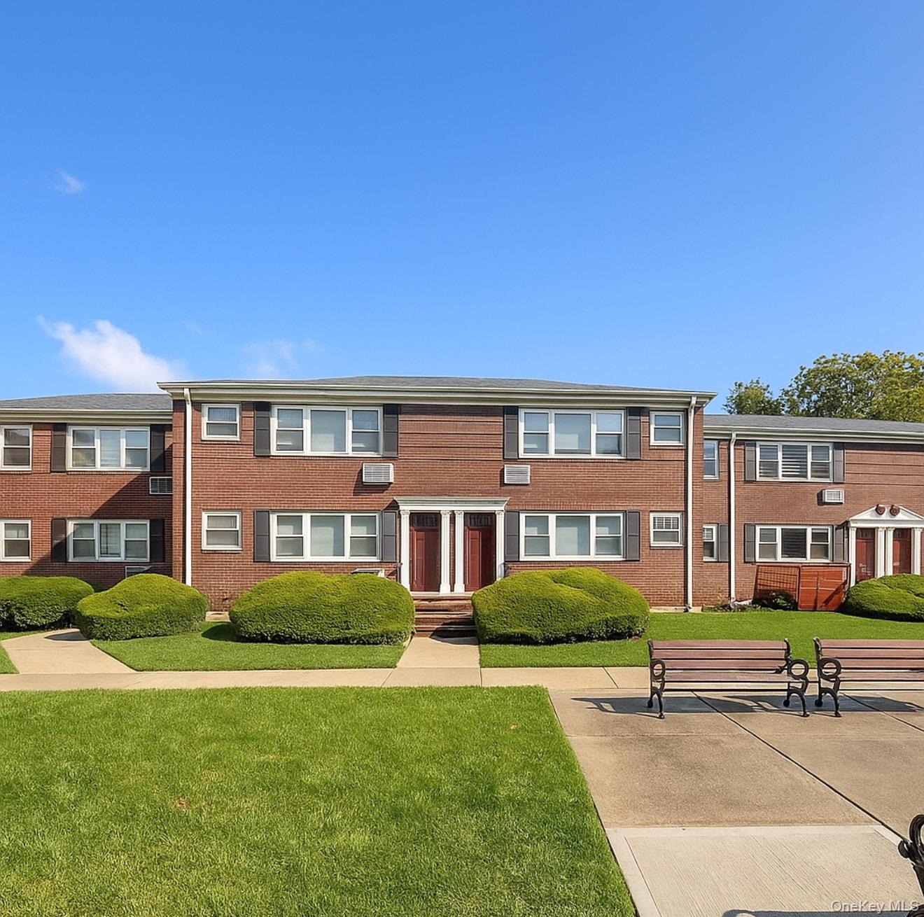 14930 Melbourne Avenue, Unit 395A Queens, NY 11367 - Photo 8 of 8 a front view of building with yard