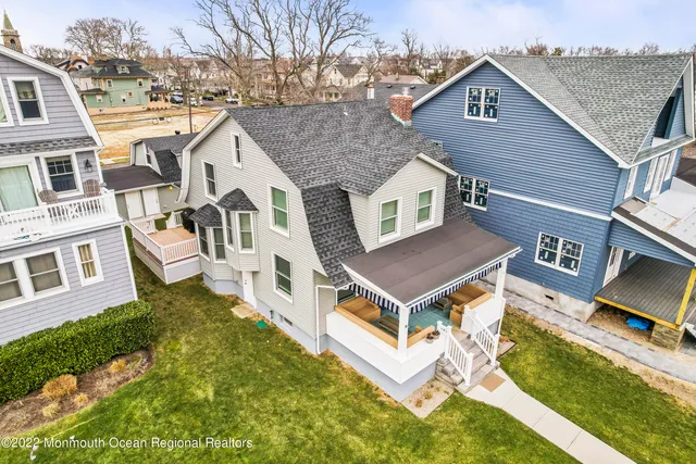a aerial view of a house with a yard