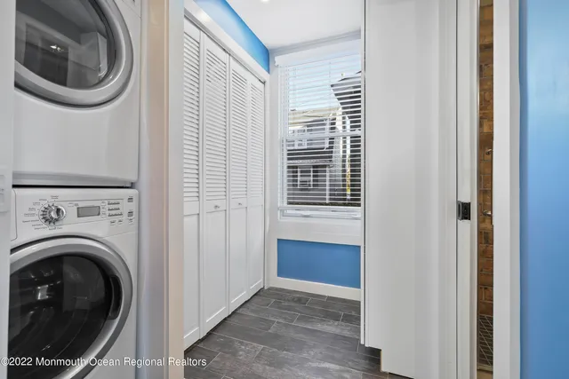 a view of a hallway with washer and dryer