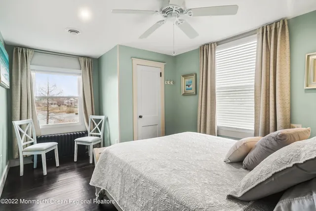 a bedroom with a bed and a table