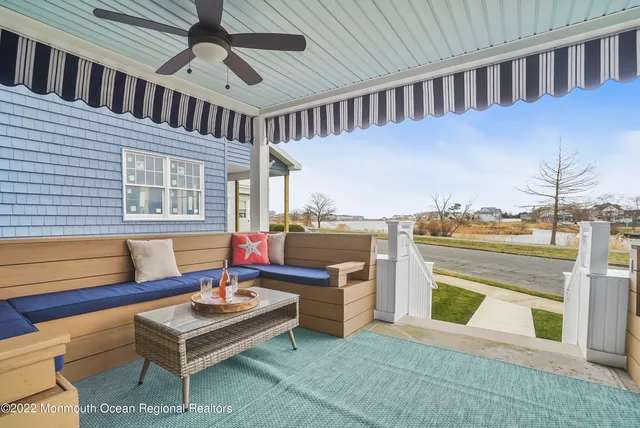a bedroom with furniture and a ceiling fan