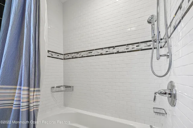 a bathroom with a shower and a bathtub