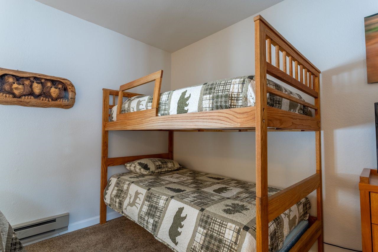 384 Joaquin Road, Unit 38 Mammoth Lakes, CA 93546 - Photo 27 of 30 a bedroom with a bed and dresser