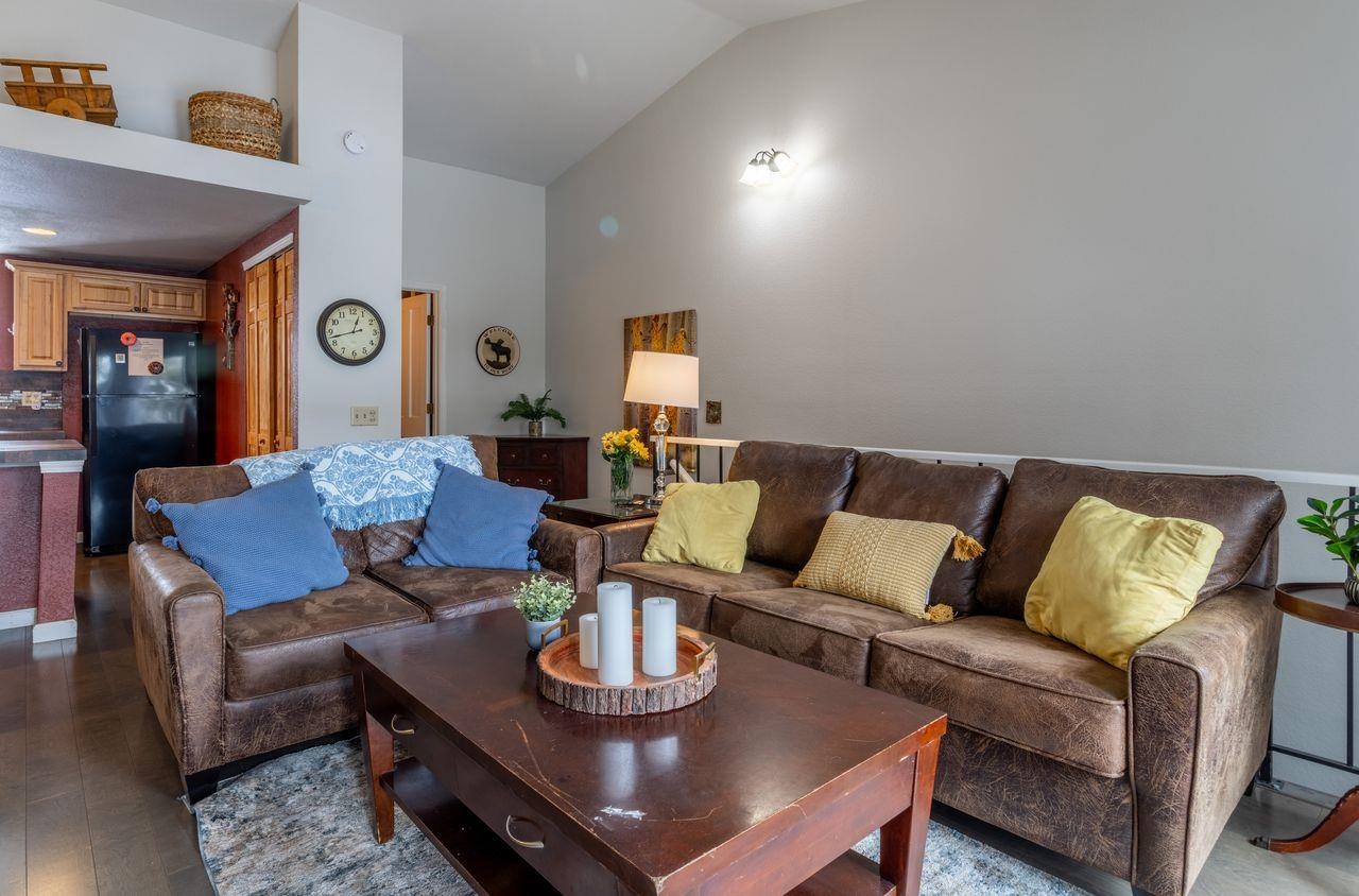 384 Joaquin Road, Unit 38 Mammoth Lakes, CA 93546 - Photo 8 of 30 a living room with furniture and a wooden floor