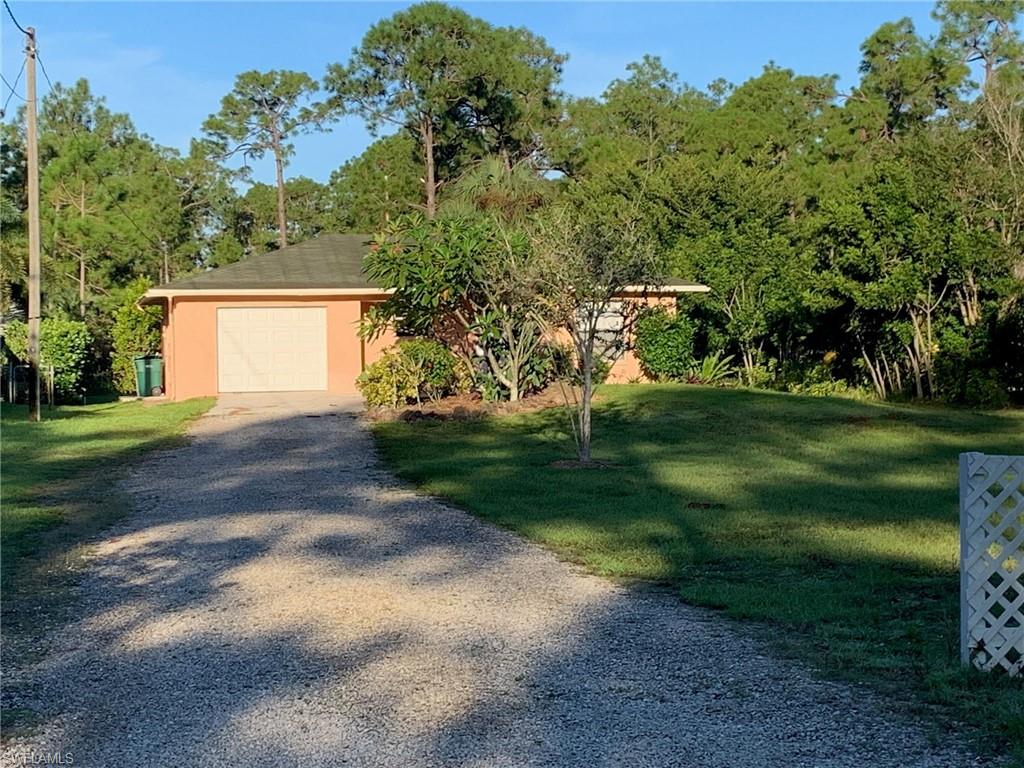 2075 17th Street Southwest Naples, FL 34117 - Photo 1 of 13 a view of a house with a yard
