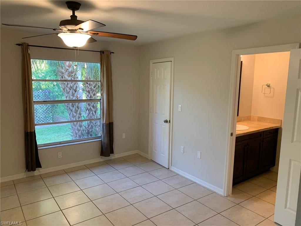 2075 17th Street Southwest Naples, FL 34117 - Photo 12 of 13 a view of an empty room with a window