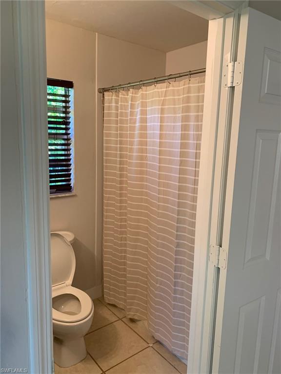 2075 17th Street Southwest Naples, FL 34117 - Photo 13 of 13 a bathroom with a toilet and a sink