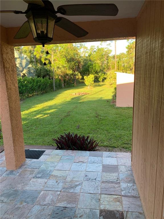 2075 17th Street Southwest Naples, FL 34117 - Photo 2 of 13 a view of a back yard of the house