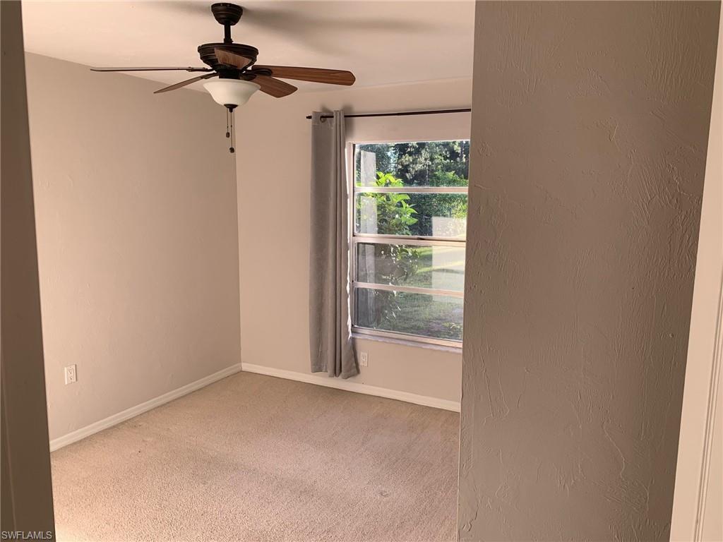 2075 17th Street Southwest Naples, FL 34117 - Photo 5 of 13 a view of an empty room with a window