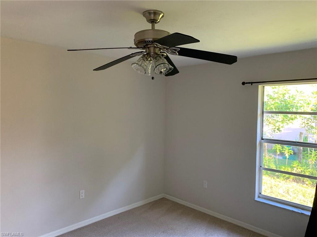 2075 17th Street Southwest Naples, FL 34117 - Photo 6 of 13 a bathroom with a window and a shower