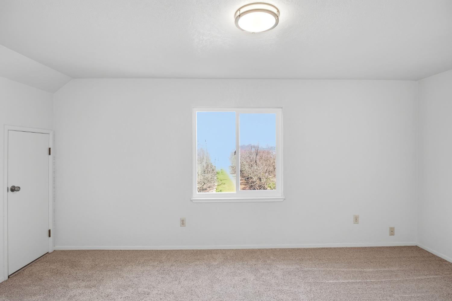 16166 Lawrence Road Escalon, CA 95320 - Photo 28 of 56 an empty room with windows
