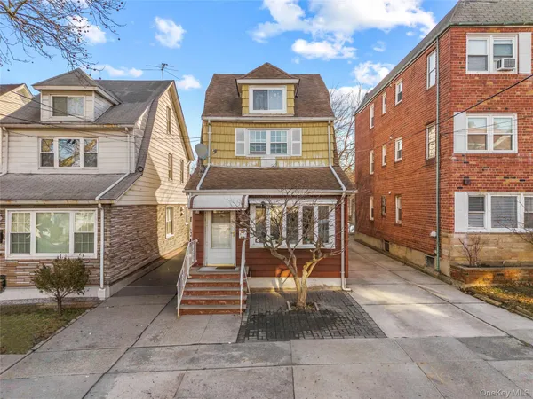 a front view of a house with a porch