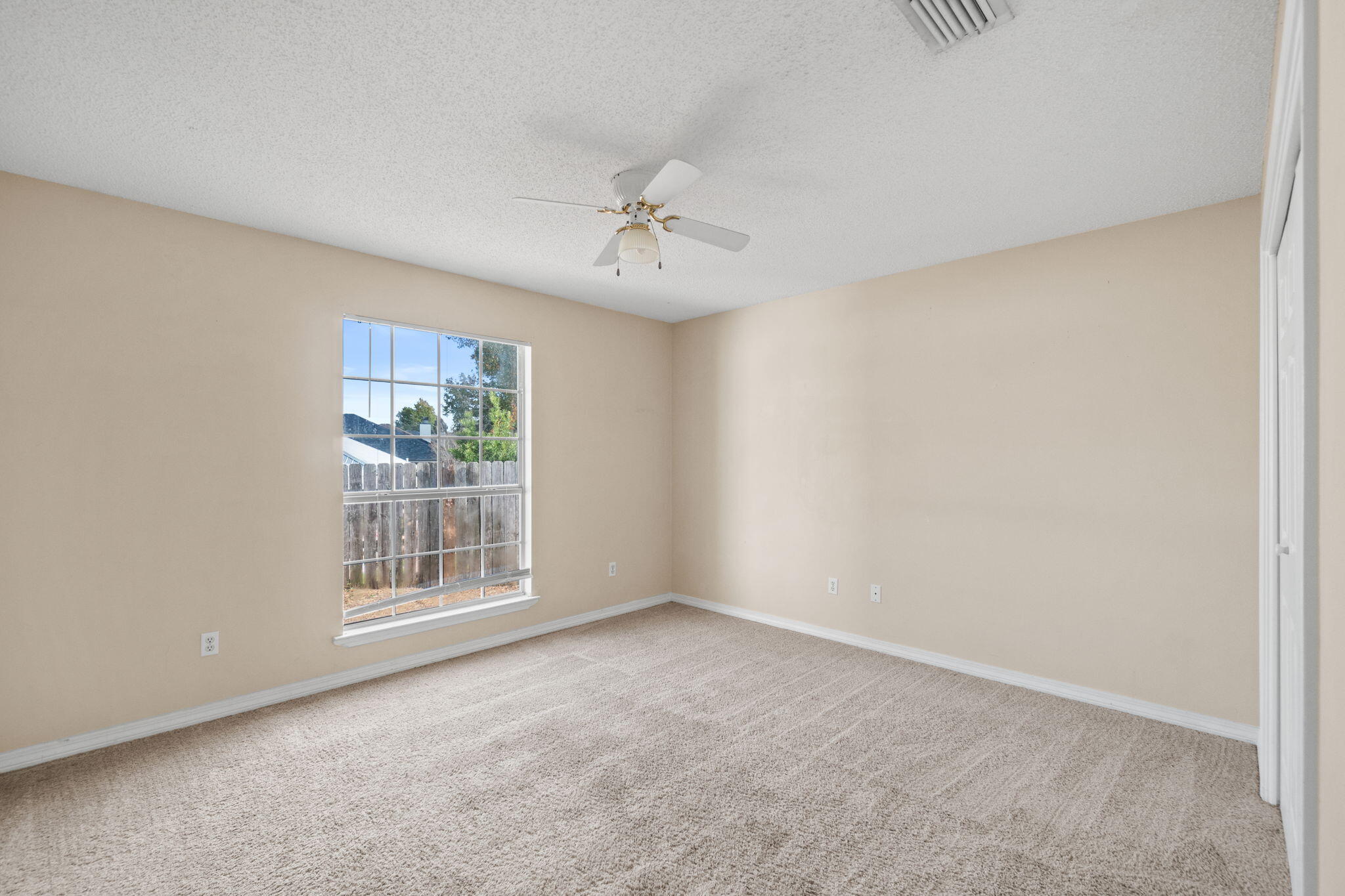 3607 Goldsbys Way Destin, FL 32541 - Photo 16 of 26 an empty room with windows and closet