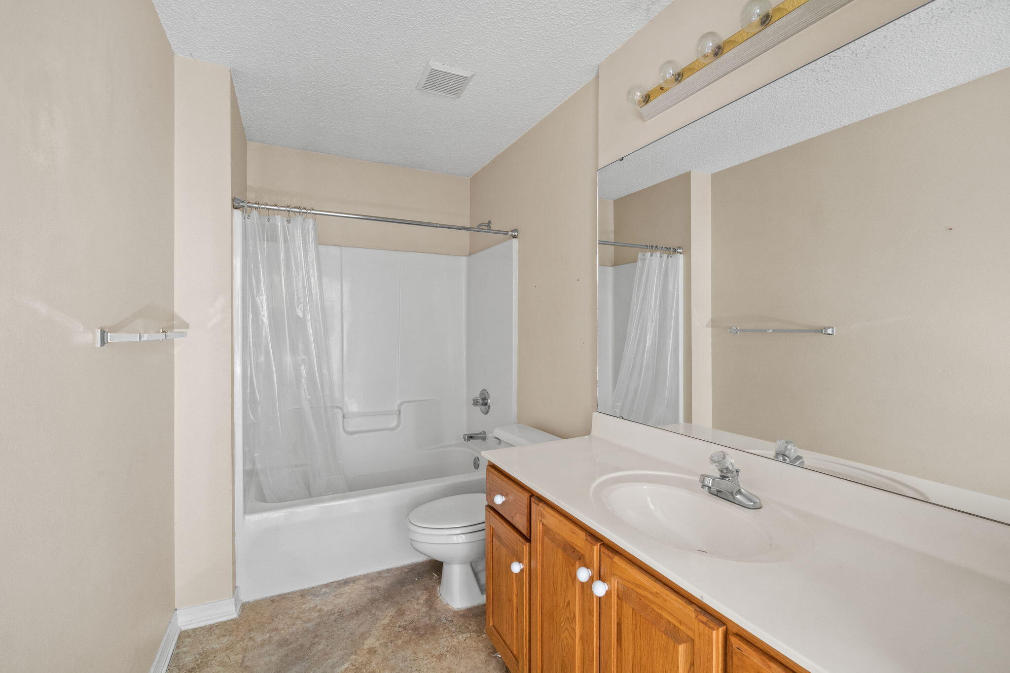 3607 Goldsbys Way Destin, FL 32541 - Photo 18 of 26 a bathroom with a granite countertop sink toilet and shower