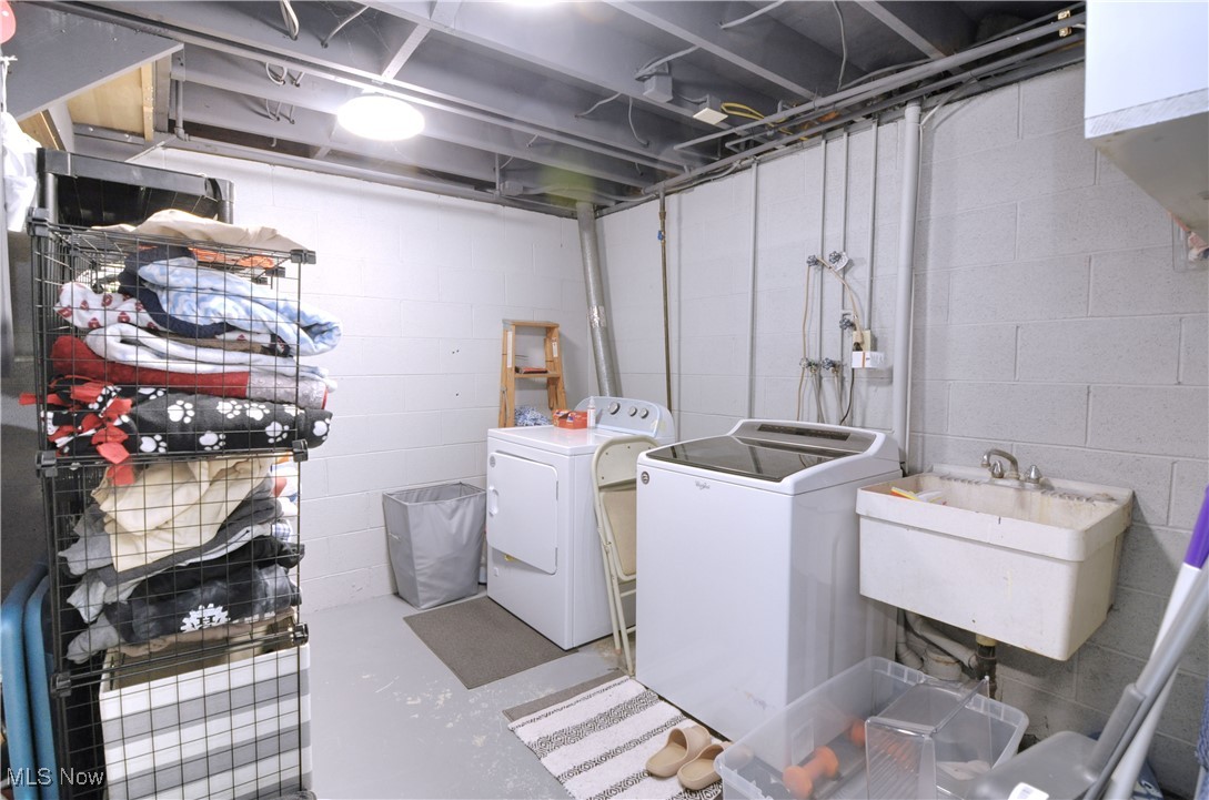 7777 Ridge Road Wadsworth, OH 44281 - Photo 16 of 30 Clothes washing area with washer and clothes dryer and sink