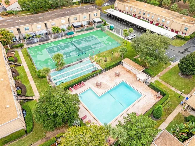 an aerial view of residential house with outdoor space and pool