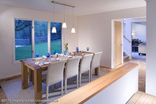 230 Riverside Drive Basalt, CO 81621 - Photo 4 of 12 a view of a dining room with furniture wooden floor and chandelier