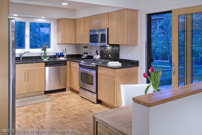 230 Riverside Drive Basalt, CO 81621 - Photo 5 of 12 a kitchen with stainless steel appliances granite countertop a stove a sink and a refrigerator