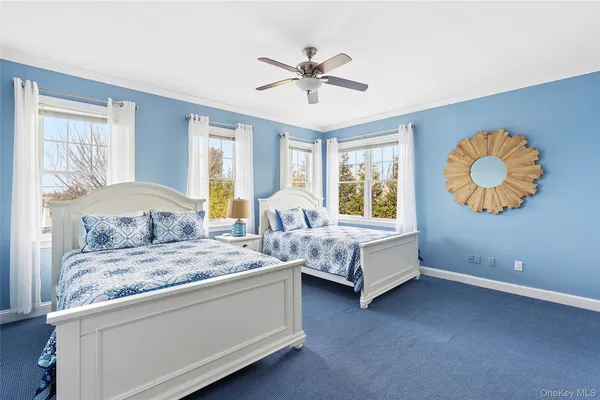a spacious bedroom with a bed and window
