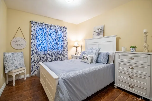 a bedroom with a bed and a table in it