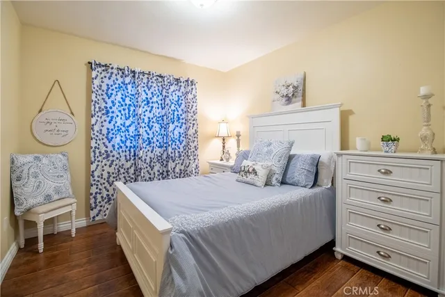 a bedroom with a bed and a table in it