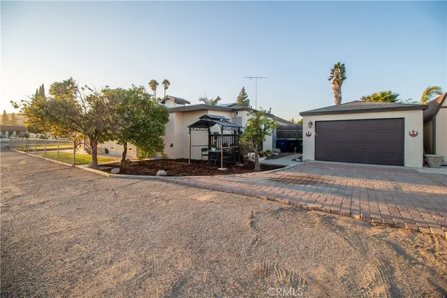 a view of a house with a street