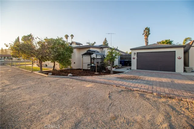 a view of a house with a street