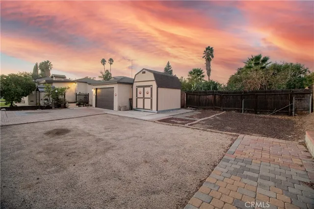 a view of a house with a backyard