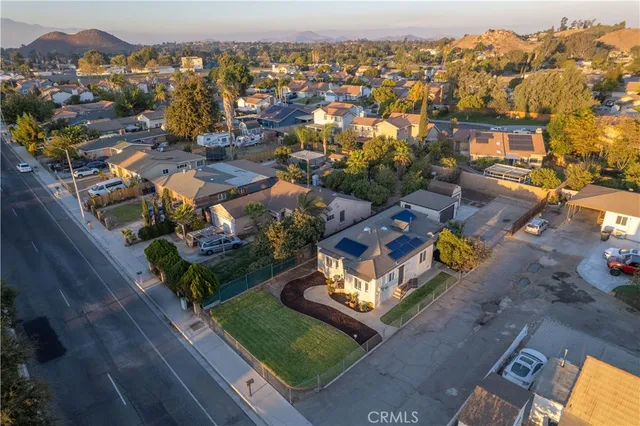 an aerial view of multiple houses with yard