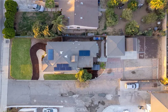 an aerial view of a house with outdoor space and a lake view