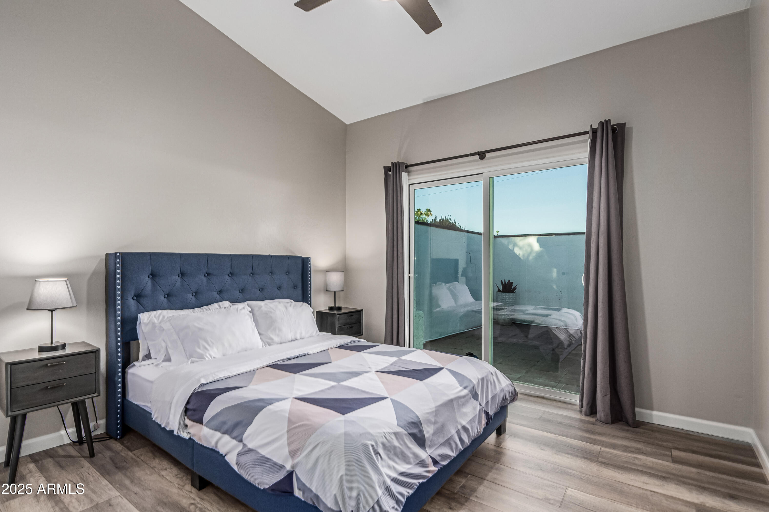 3438 North 30th Street Phoenix, AZ 85016 - Photo 12 of 26 a bedroom with a bed and a mirror