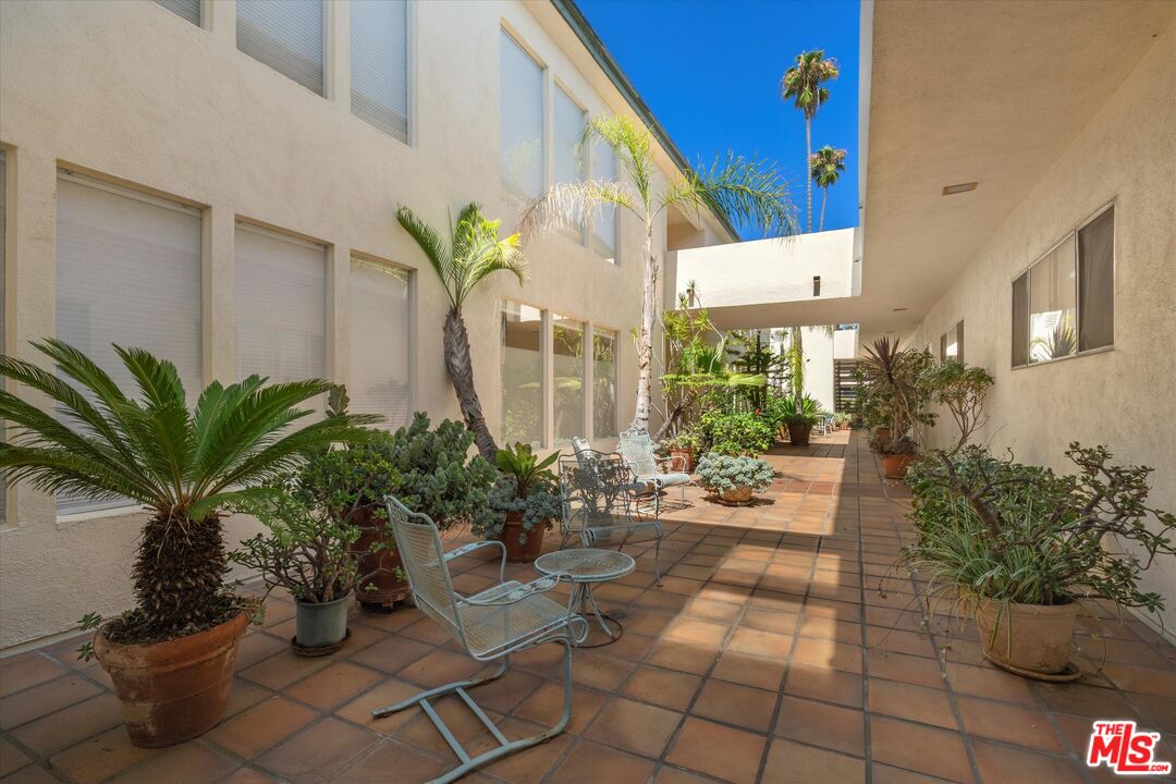 854 18th Street, Unit 6 Santa Monica, CA 90403 - Photo 20 of 22 a building with potted plants in front of it