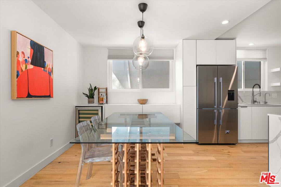 854 18th Street, Unit 6 Santa Monica, CA 90403 - Photo 5 of 22 a view of a refrigerator in kitchen and wooden floor