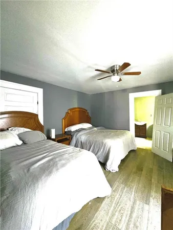 a bedroom with two beds and painted walls