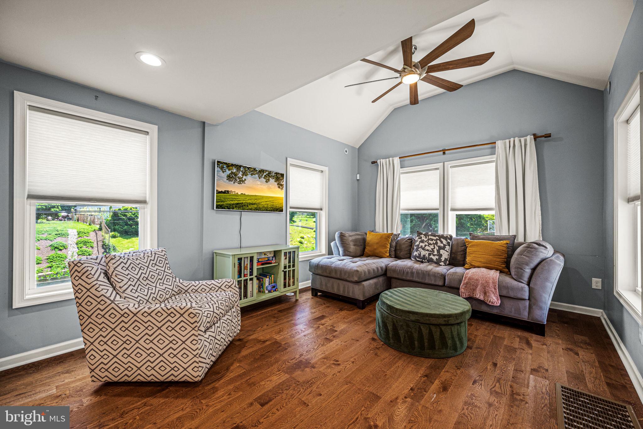 177 Bortondale Road Media, PA 19063 - Photo 11 of 33 a living room with furniture floor to ceiling window and wooden floor