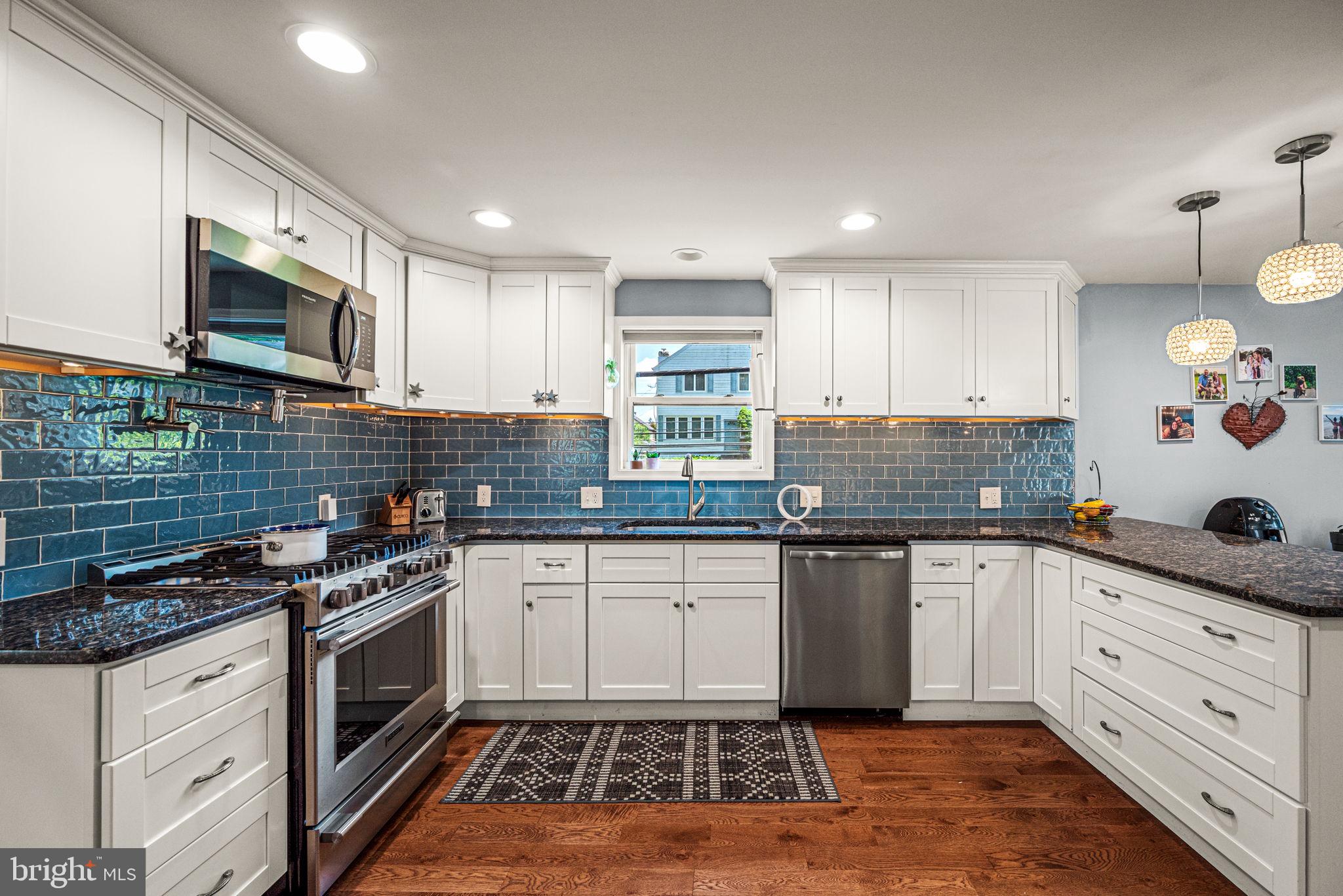 177 Bortondale Road Media, PA 19063 - Photo 14 of 33 a kitchen with granite countertop cabinets stainless steel appliances and a sink