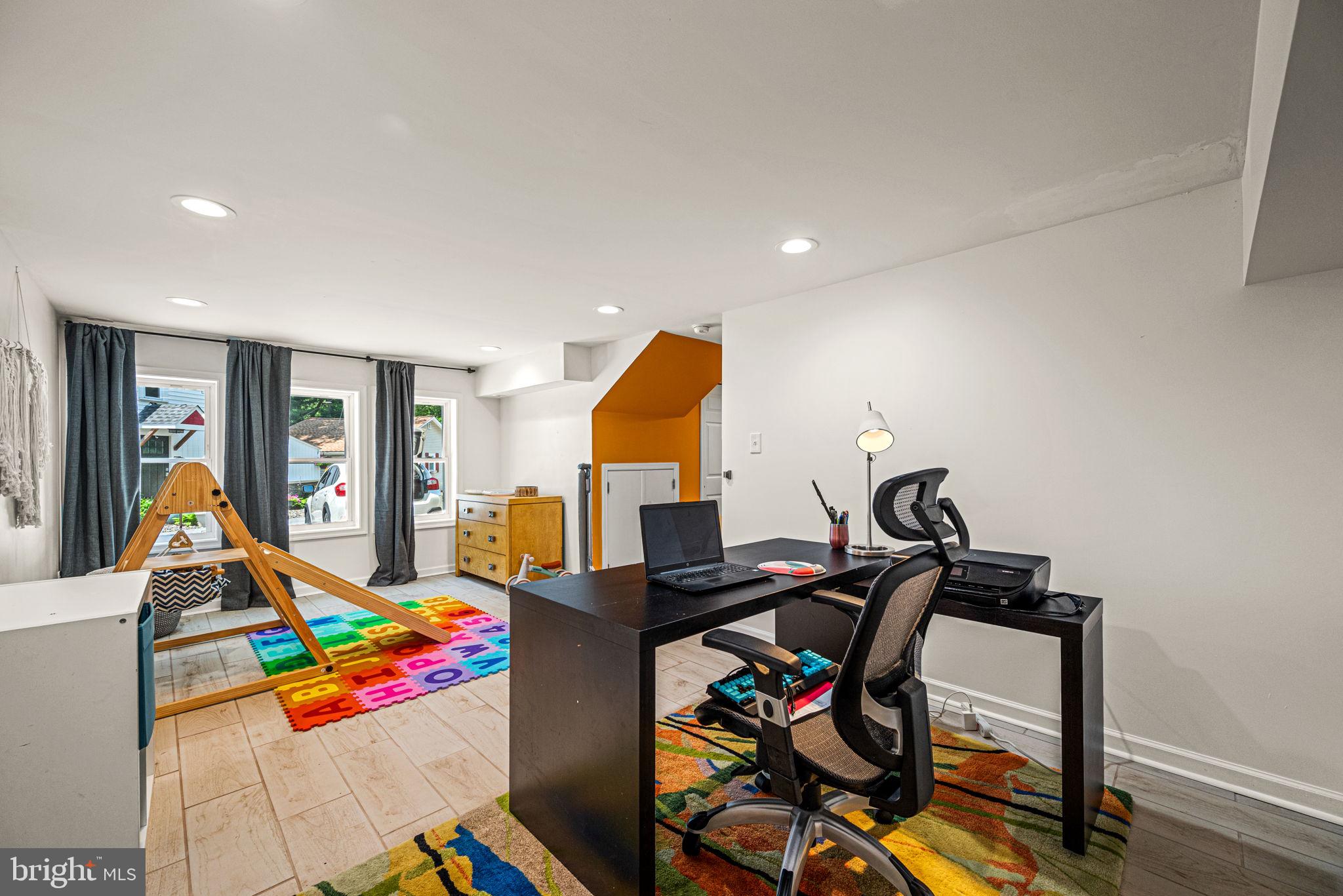 177 Bortondale Road Media, PA 19063 - Photo 10 of 33 a living room with furniture and gym equipment