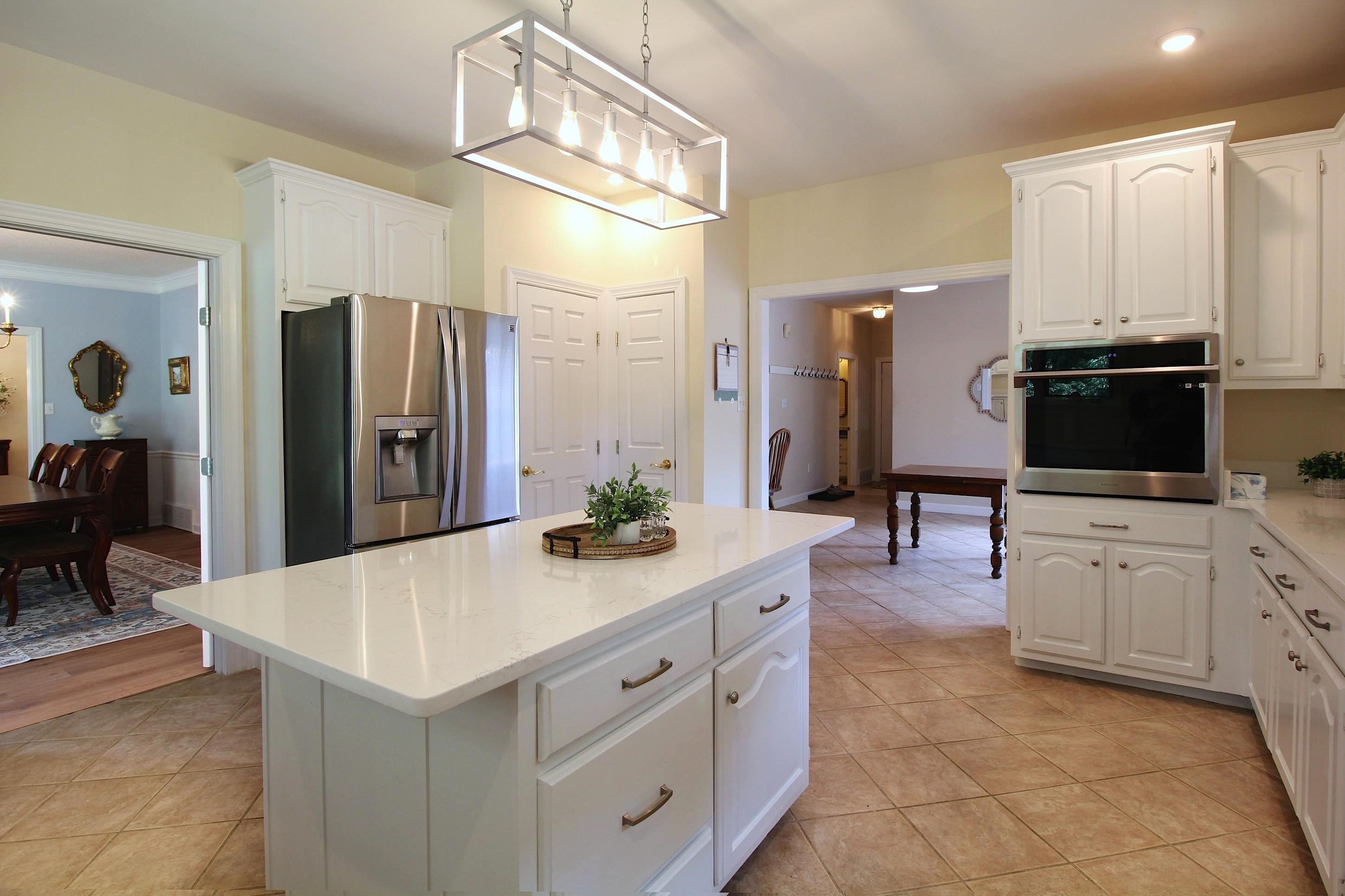 2550 North Reid Hooker Road Eads, TN 38028 - Photo 8 of 32 a spacious kitchen with stainless steel appliances a sink and cabinets