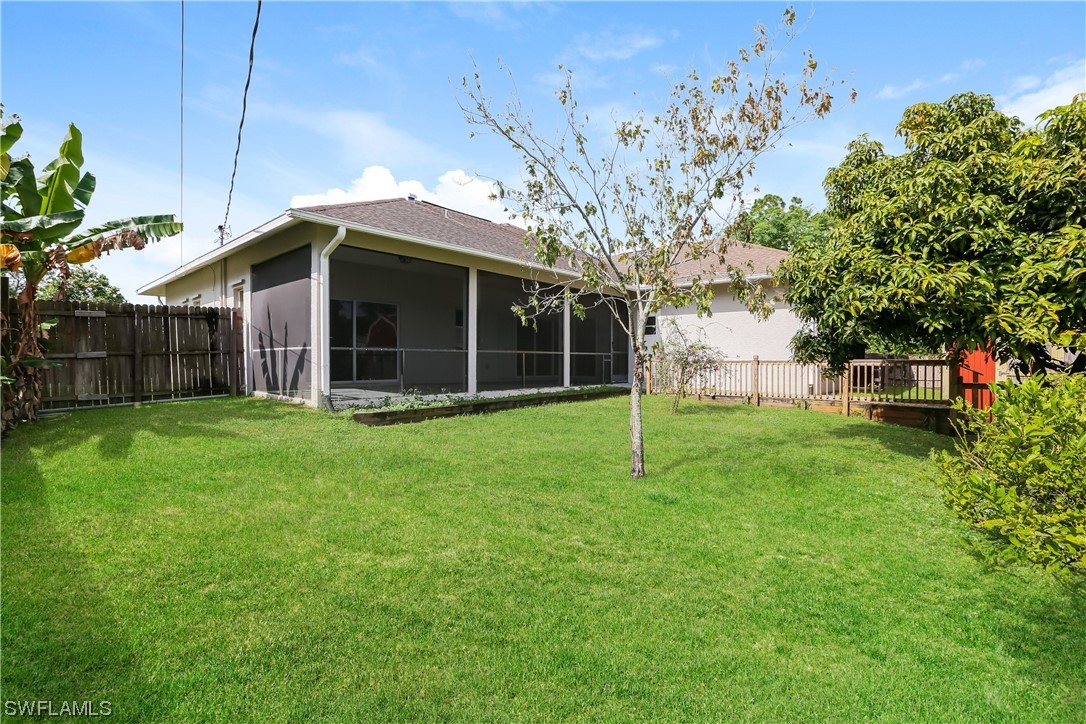 8373 Butternut Road Fort Myers, FL 33967 - Photo 13 of 13 a view of a house with a backyard