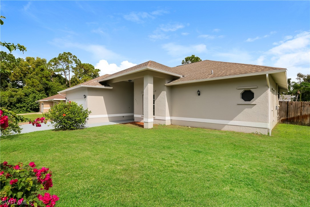 8373 Butternut Road Fort Myers, FL 33967 - Photo 2 of 13 a view of a back yard of the house
