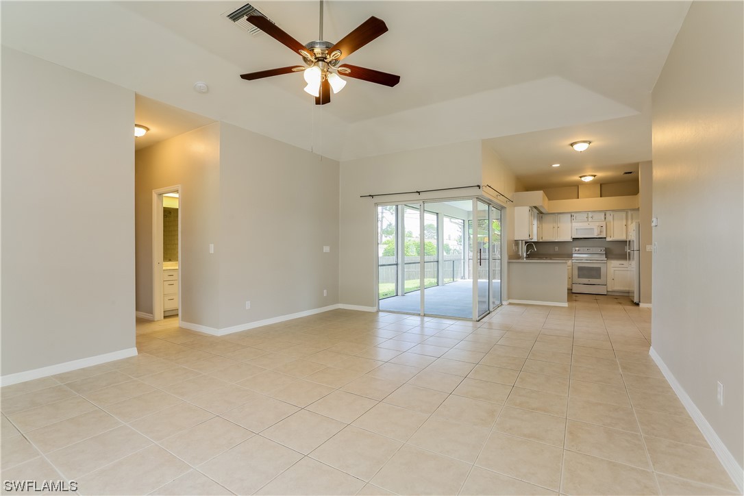 8373 Butternut Road Fort Myers, FL 33967 - Photo 9 of 13 a view of an empty room with a window