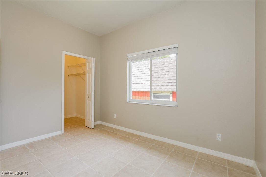 8373 Butternut Road Fort Myers, FL 33967 - Photo 10 of 13 an empty room with windows